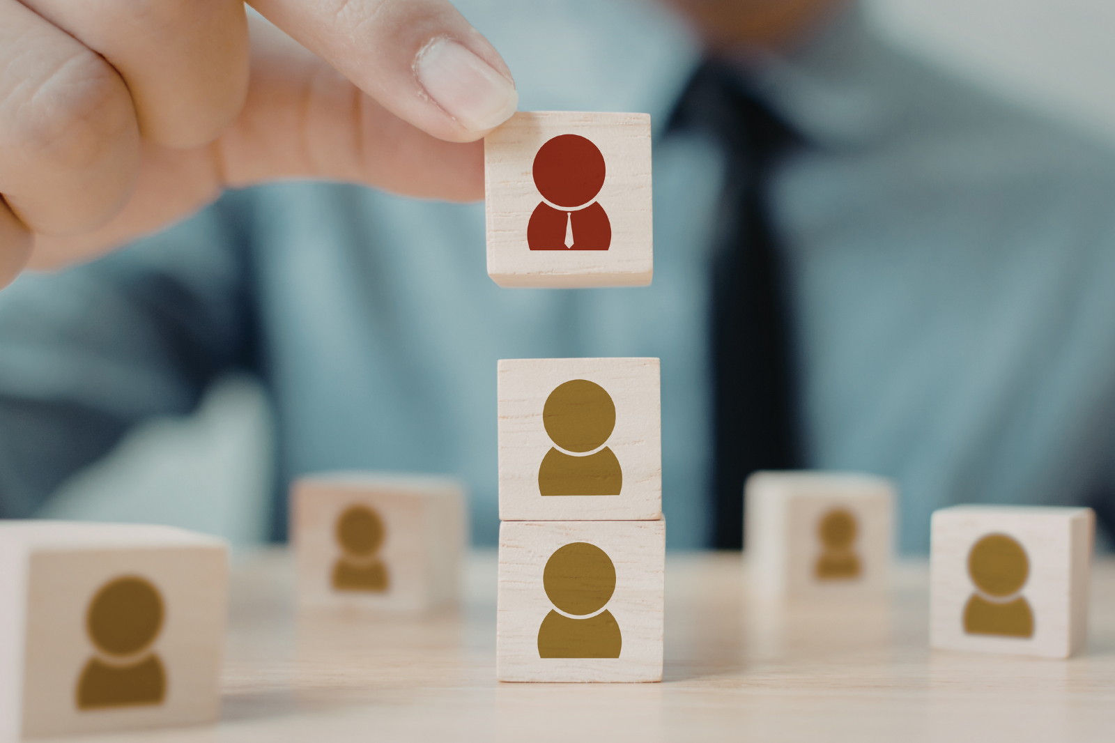 HR professionals in UAE and Saudi Arabia managing recruitment workflows, balancing high hiring demand, compliance rules, and employee wellbeing in a modern office environment.